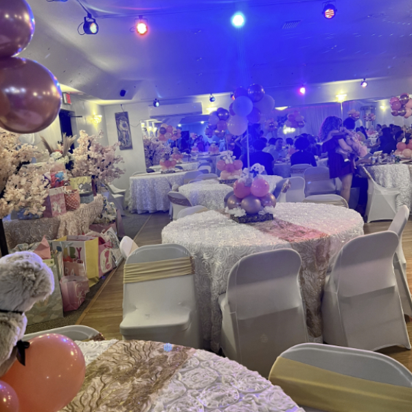 circular white tables with bear centerpieces pink balloons and baby shower gift table