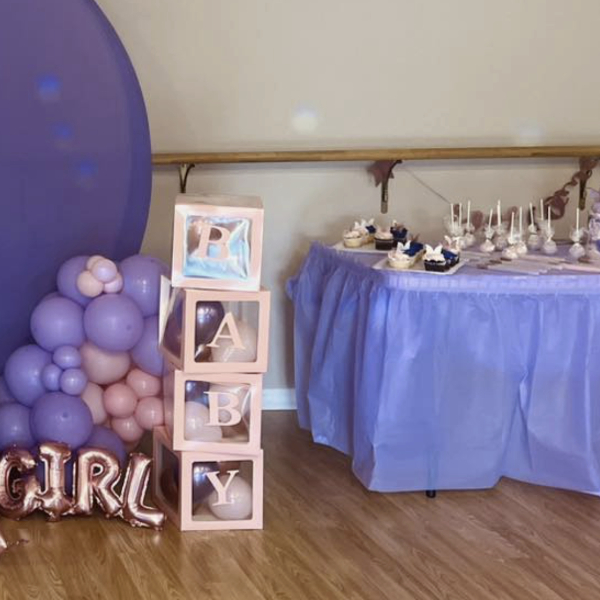 its a girl baby shower theme pink blocks with purple balloons