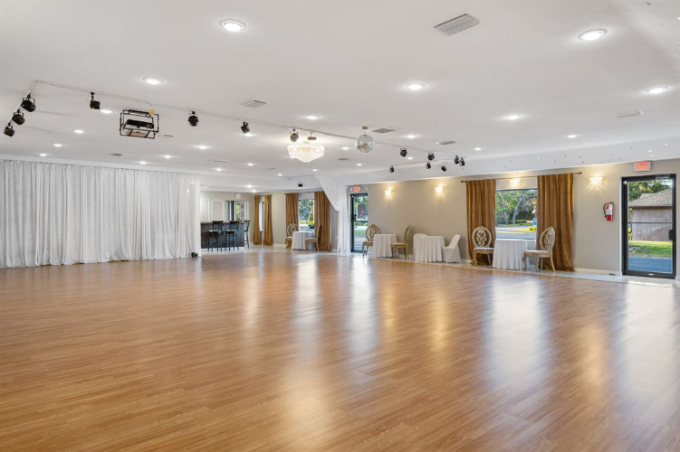 large open space venue hall with wood floor